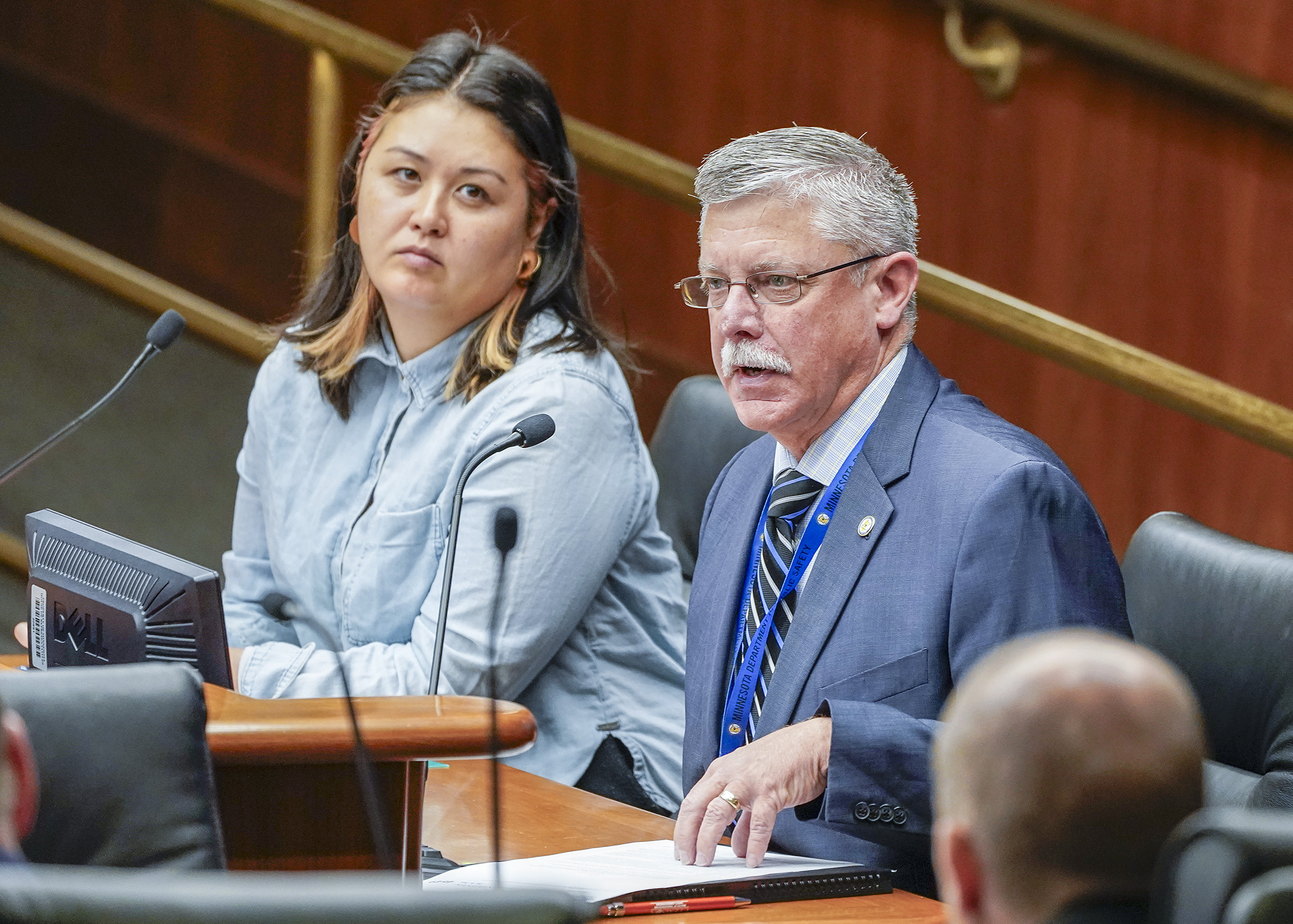 Mike Hanson, director of the Office of Traffic Safety, testifies before the House transportation committee March 19 in support of a bill sponsored by Rep. Samantha Sencer-Mura, left, to modify child passenger restraint provisions. (Photo by Andrew VonBank)